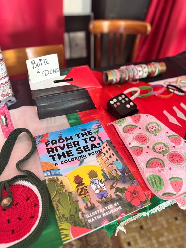 Donation box on a solidarity stall with volunteer-made items.